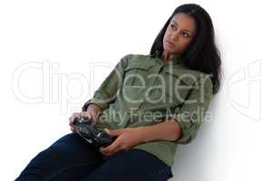 Thoughtful woman playing video games