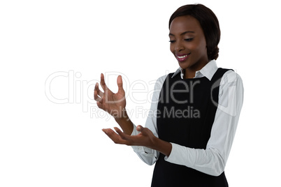 Happy woman gesturing against white background