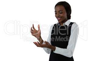 Happy woman gesturing against white background