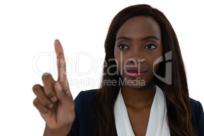 Confident businesswoman touching imaginary screen
