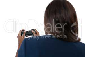 Rear view of businesswoman playing video game
