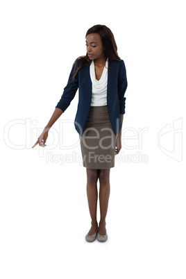 Full length of businesswoman pointing