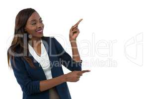 Smiling businesswoman gesturing during presentation