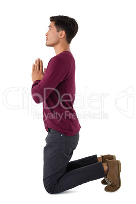 Side view of business praying