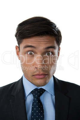 Portrait of young businessman with raised eyebrows