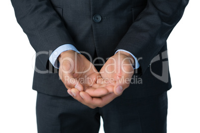 Midsection of businessman with hands cupped