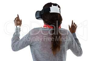 Rear view of woman gesturing while using vr glasses