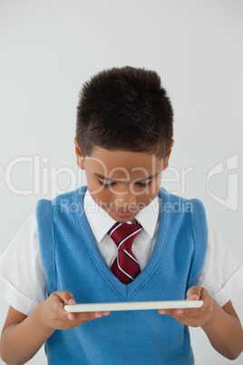 Schoolboy using digital tablet