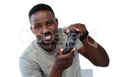 Man playing video game against white background