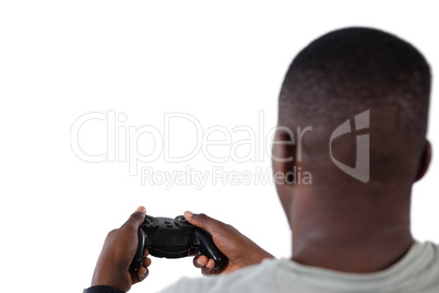 Man playing video game against white background