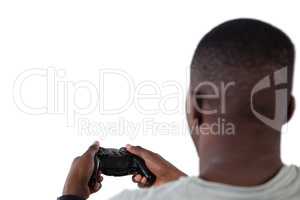 Man playing video game against white background