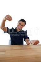 Businesswoman pretending to work on an invisible object