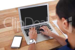 Businesswoman using laptop on the table