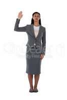 Businesswoman raising her hand