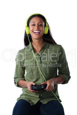 Woman playing video game against white background