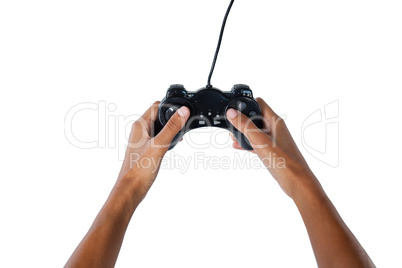 Hand of womans playing video game against white background