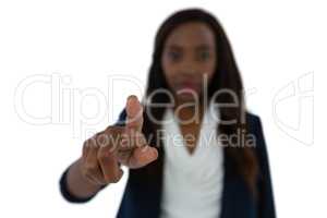 Young businesswoman touching imaginary screen