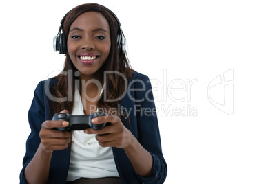 Cheerful businesswoman playing video game