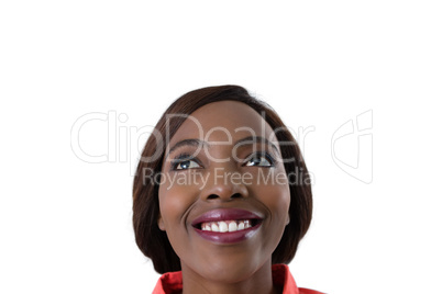 Close up of cheerful woman looking up