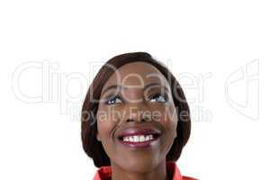 Close up of cheerful woman looking up
