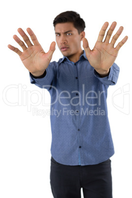 Portrait of young businessman gesturing