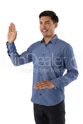 Smiling businessman waving hand