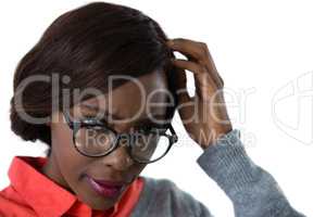 Close up of confused young woman wearing eyeglasses