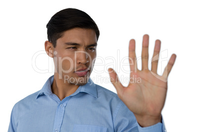 Close up of young businessman touching invisible screen
