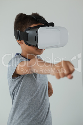 Schoolboy using virtual reality headset