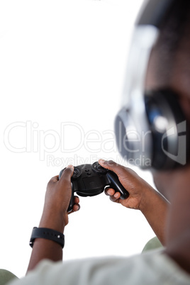 Man playing video game against white background