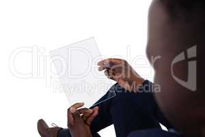 Businessman using a glass digital tablet