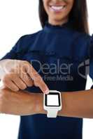 Female executive operating her smartwatch