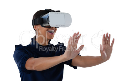 Woman gesturing while using virtual reality headset