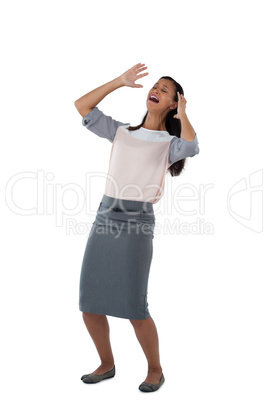 Businesswoman shouting against white background