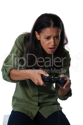 Woman playing video game against white background