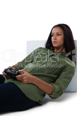 Thoughtful woman playing video games