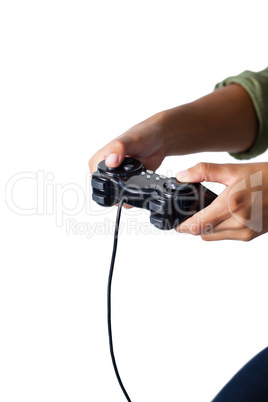 Woman playing video game against white background