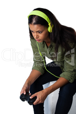 Thoughtful woman holding joystick