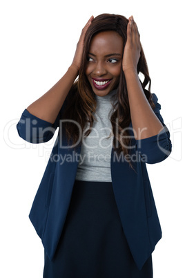 Smiling businesswoman with head in hand