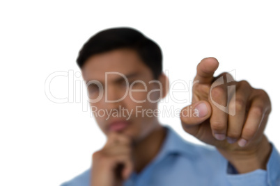 Close up of businessman hand touching invisible interface