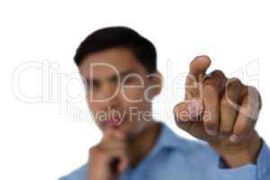 Close up of businessman hand touching invisible interface
