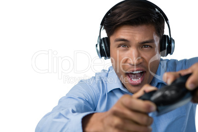 Young businessman making face while playing video game