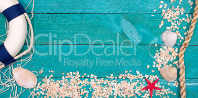 Beach utensils on wooden background - summer holidays