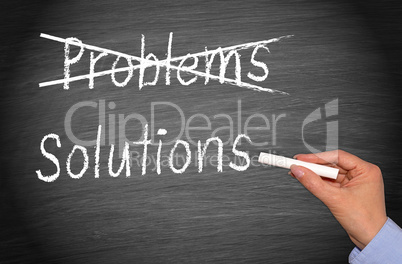 Crossing out problems and writing solutions on chalkboard or blackboard