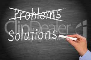 Crossing out problems and writing solutions on chalkboard or blackboard
