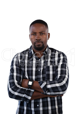 Man standing with arms crossed against white background