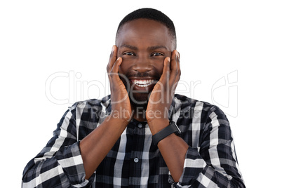 Happy man standing against white background