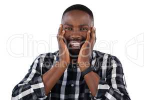 Happy man standing against white background