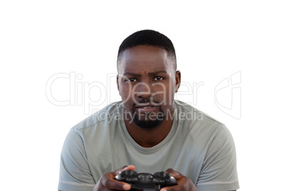 Man playing video game against white background