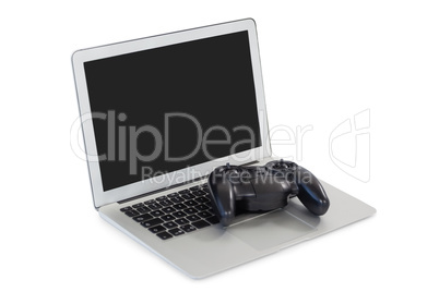 Joystick and laptop on white background